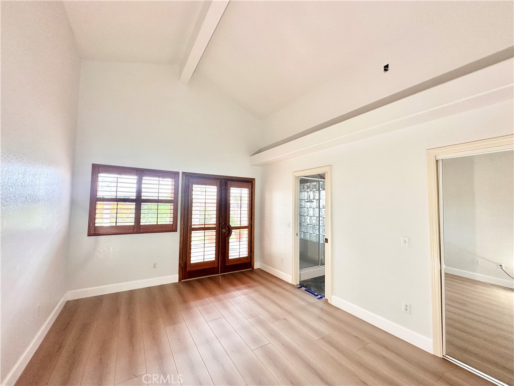 14132 Roxanne Drive Westminster, CA 92683 - Photo 25 of 36 an empty room with wooden floor and windows