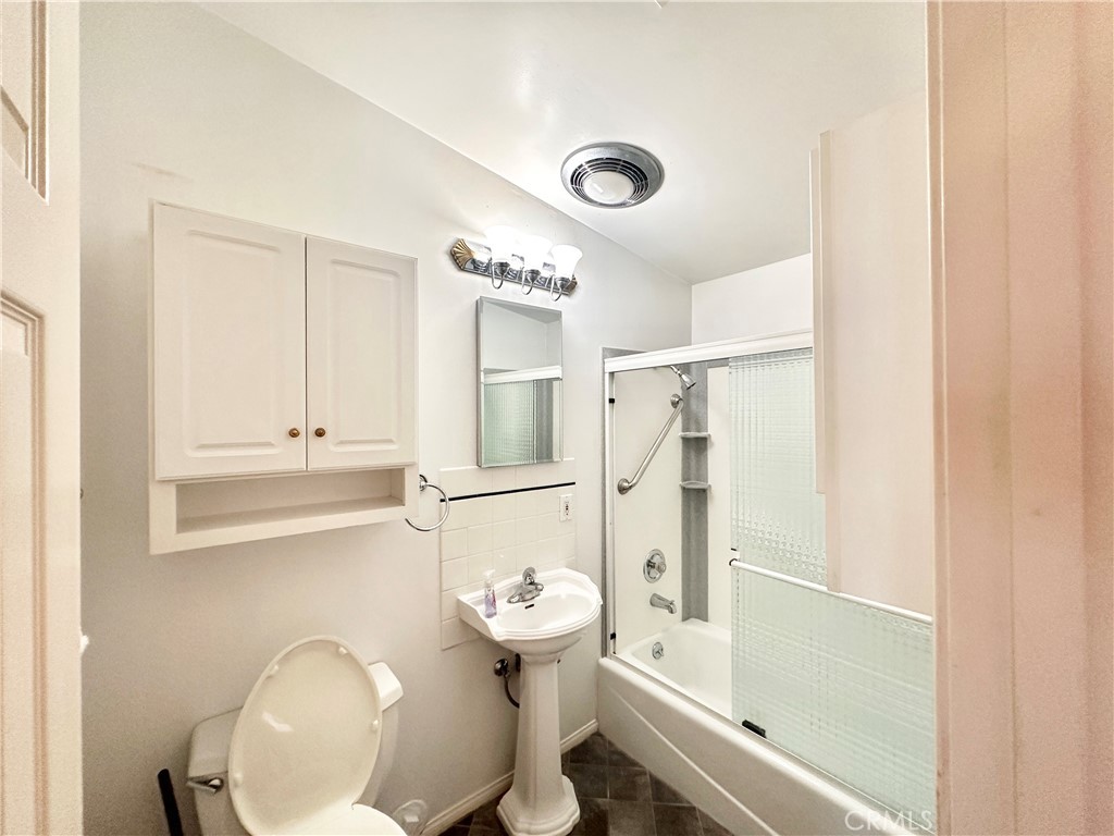 14132 Roxanne Drive Westminster, CA 92683 - Photo 3 of 36 a bathroom with a sink a toilet and shower