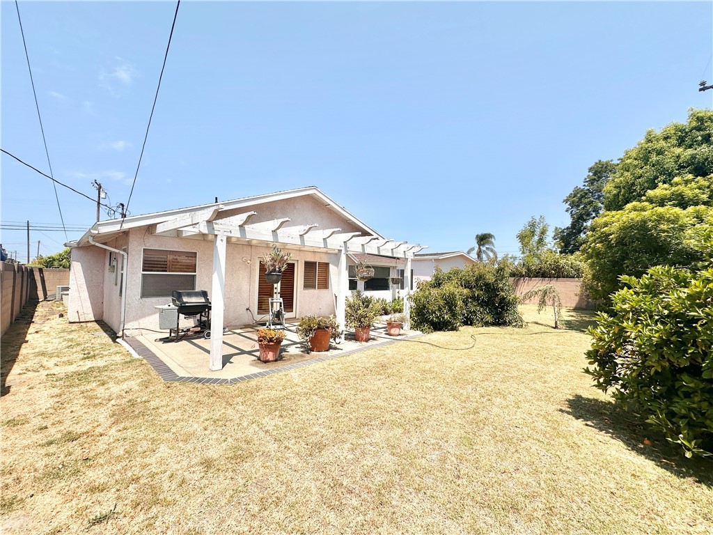 14132 Roxanne Drive Westminster, CA 92683 - Photo 34 of 36 a view of a house with backyard and sitting area