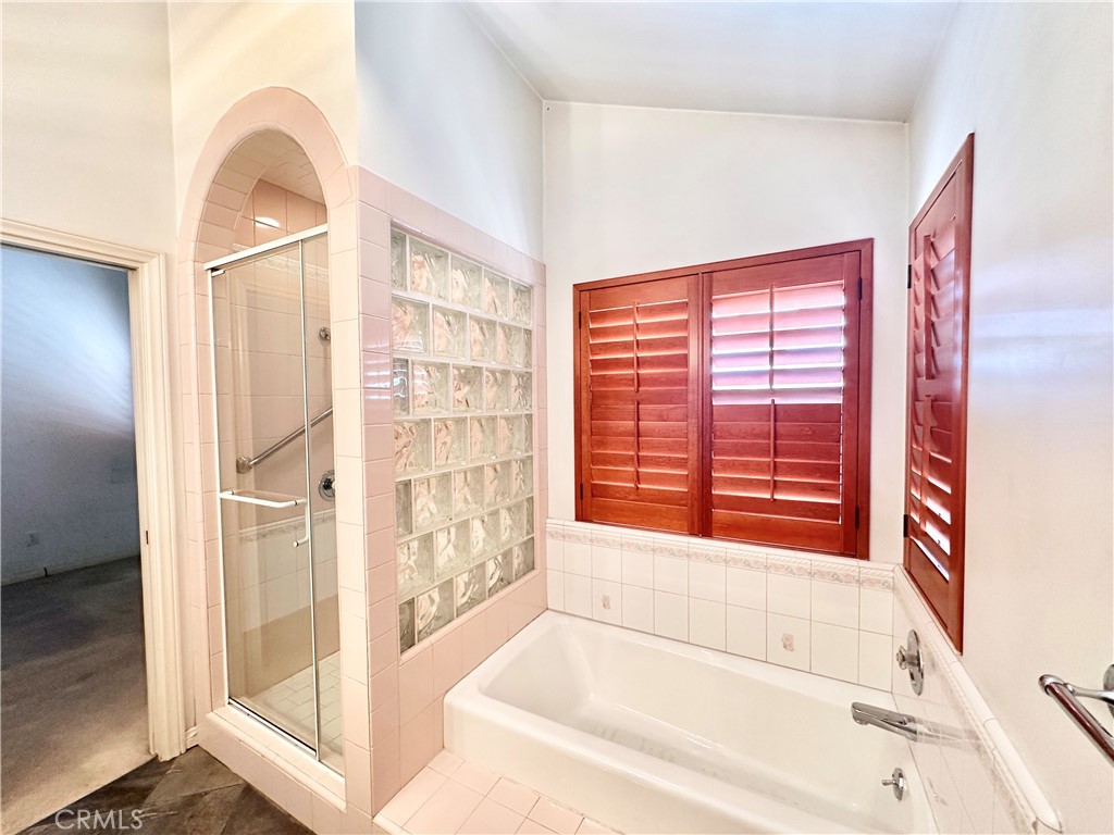 14132 Roxanne Drive Westminster, CA 92683 - Photo 7 of 36 a bathroom with a bathtub and a shower