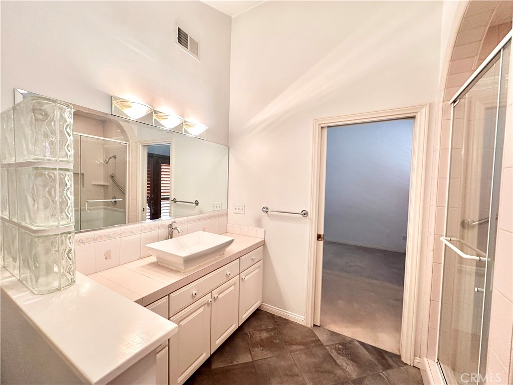 14132 Roxanne Drive Westminster, CA 92683 - Photo 8 of 36 a bathroom with a sink a vanity and a mirror