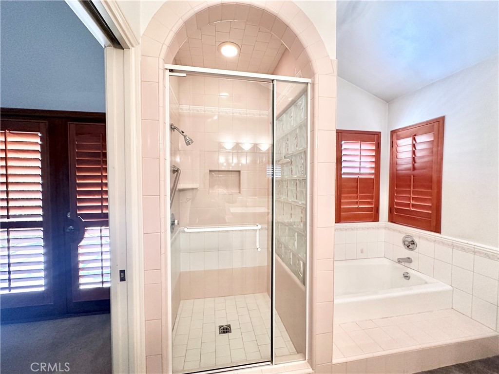 14132 Roxanne Drive Westminster, CA 92683 - Photo 9 of 36 a bathroom with a tub shower and sink