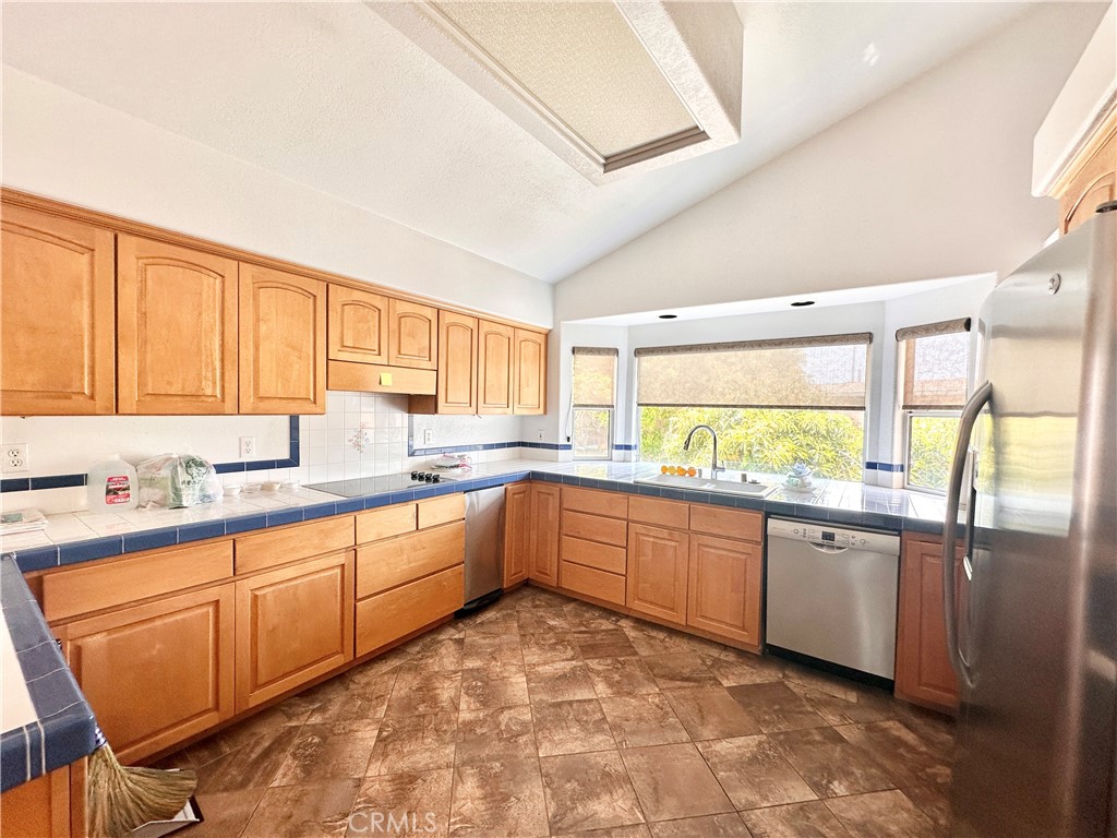 14132 Roxanne Drive Westminster, CA 92683 - Photo 10 of 36 a large kitchen with kitchen island granite countertop a large window