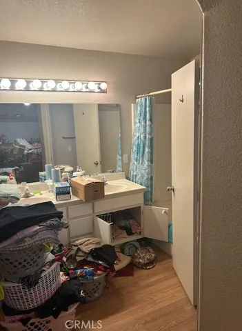 a bathroom with a sink a mirror and a bathtub