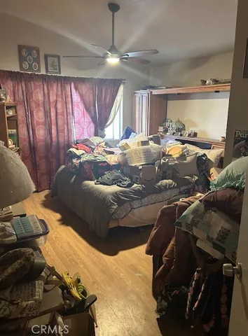 a bed room with a bed and a window