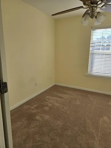 a view of a room that has a window in it