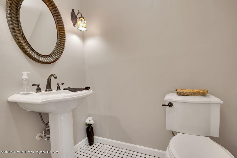 16 Woods Road West Long Branch, NJ 07764 - Photo 16 of 38 a bathroom with a sink and a toilet