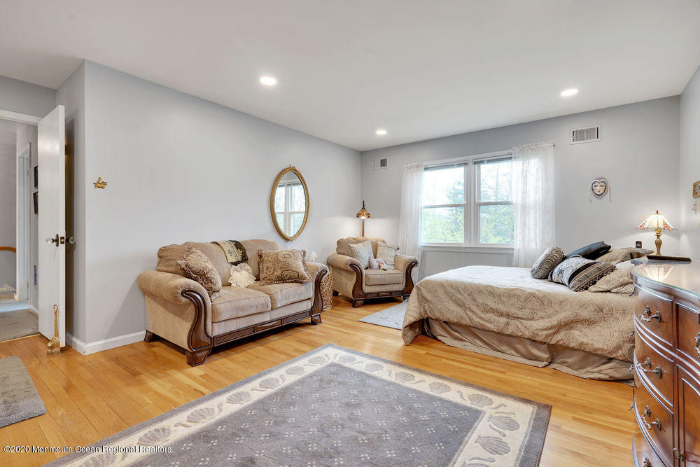 16 Woods Road West Long Branch, NJ 07764 - Photo 20 of 38 a bedroom with furniture and a large window