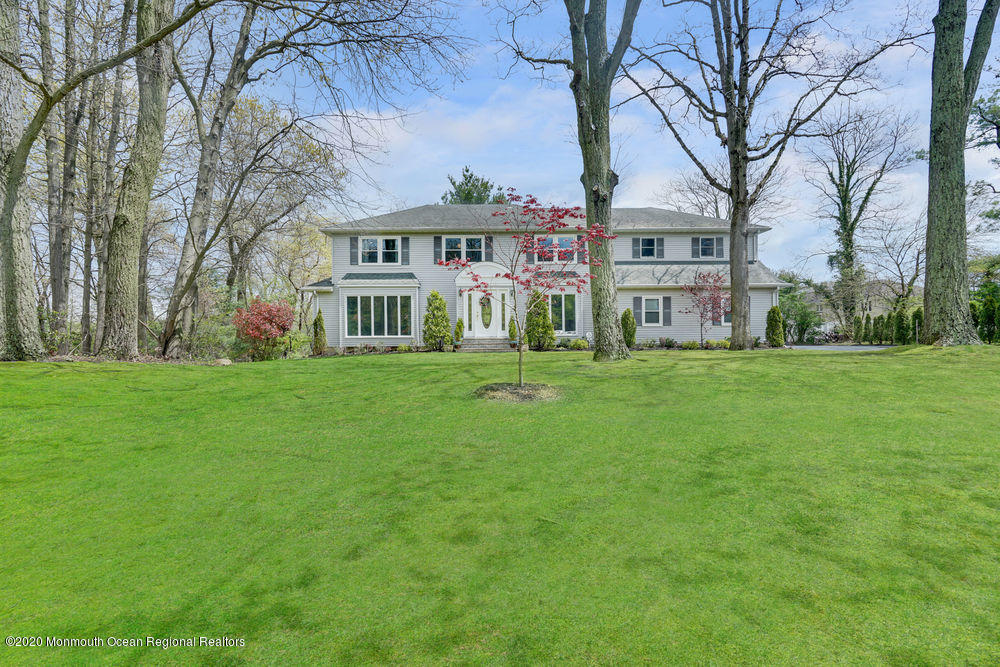 16 Woods Road West Long Branch, NJ 07764 - Photo 2 of 38 a front view of house with yard and green space