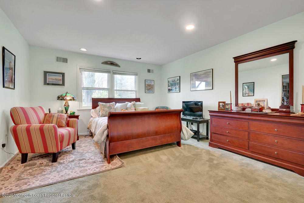 16 Woods Road West Long Branch, NJ 07764 - Photo 21 of 38 a bedroom with furniture and a large window