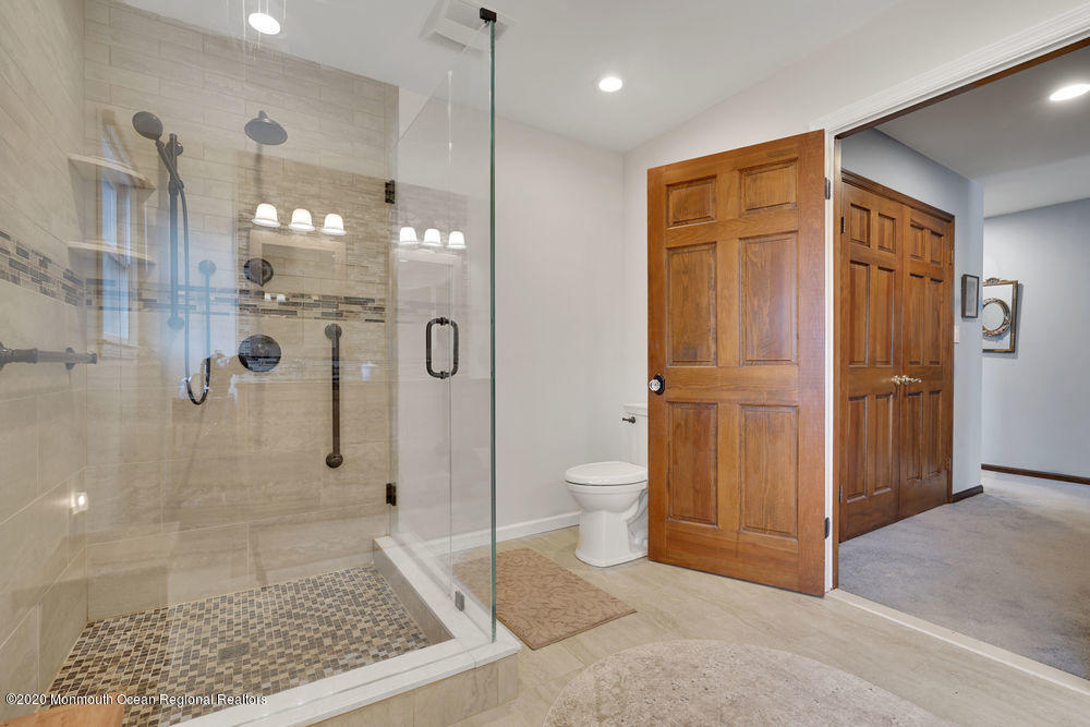 16 Woods Road West Long Branch, NJ 07764 - Photo 25 of 38 a bathroom with a glass door shower
