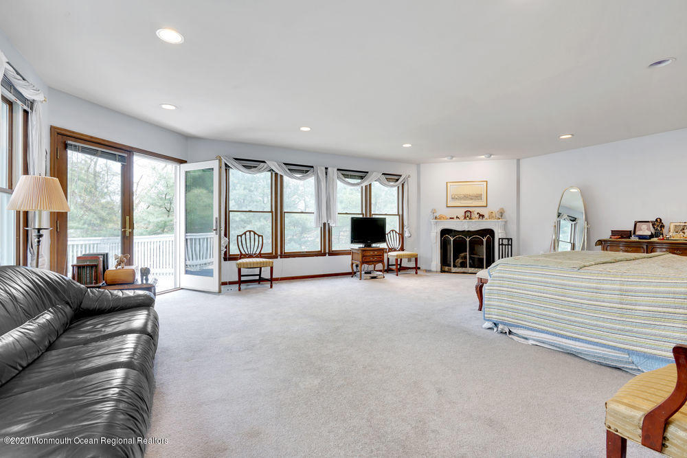 16 Woods Road West Long Branch, NJ 07764 - Photo 26 of 38 a spacious bedroom with a large bed and large windows