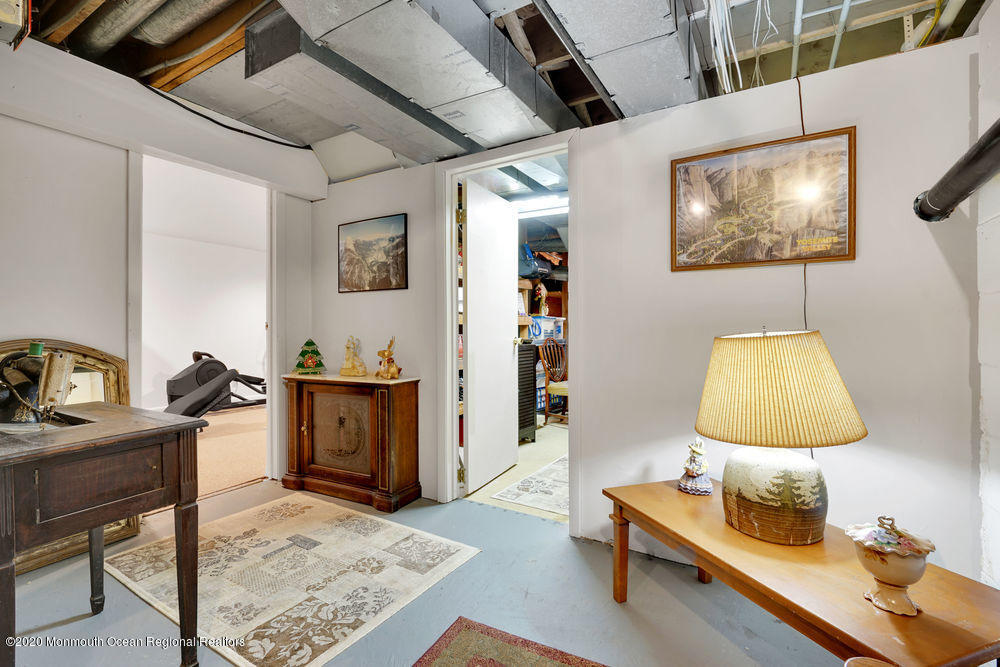 16 Woods Road West Long Branch, NJ 07764 - Photo 32 of 38 a workspace with furniture and lamp