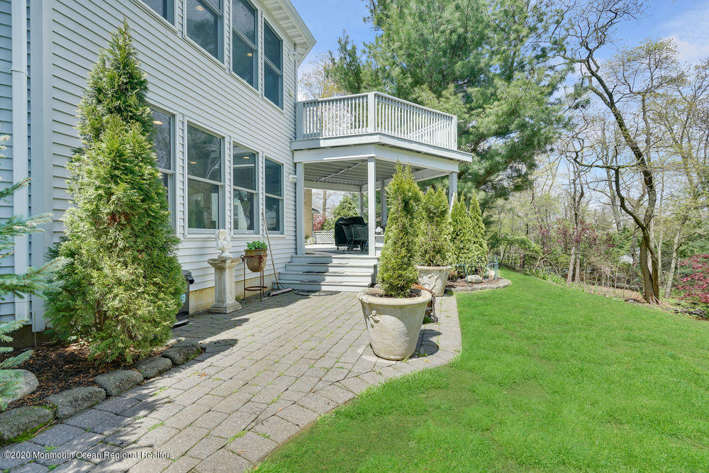 16 Woods Road West Long Branch, NJ 07764 - Photo 34 of 38 a view of a house with backyard sitting area and garden