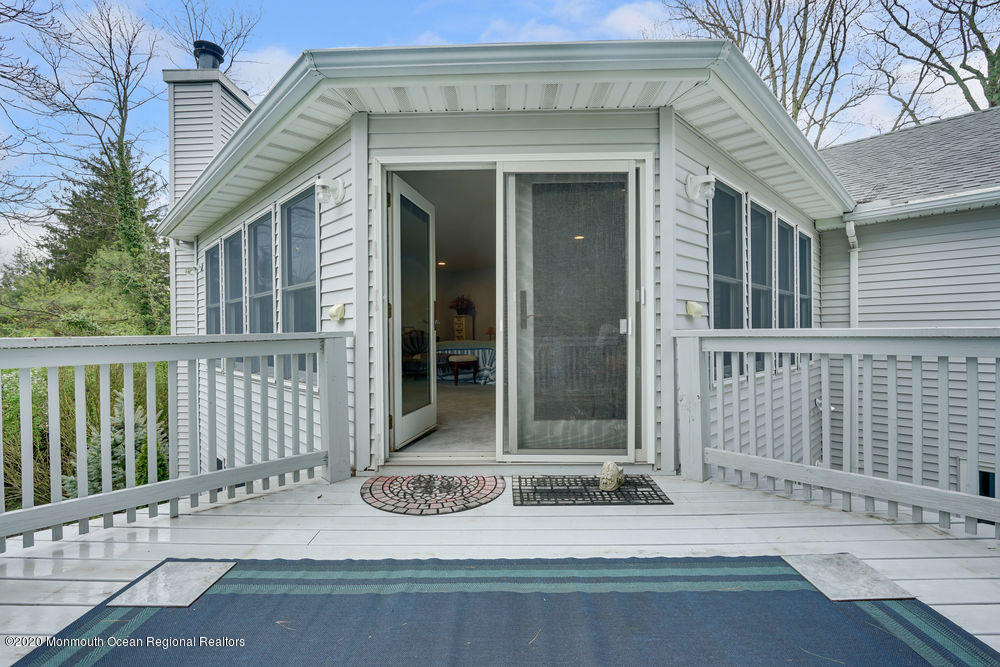 16 Woods Road West Long Branch, NJ 07764 - Photo 37 of 38 a view of house with wooden fence