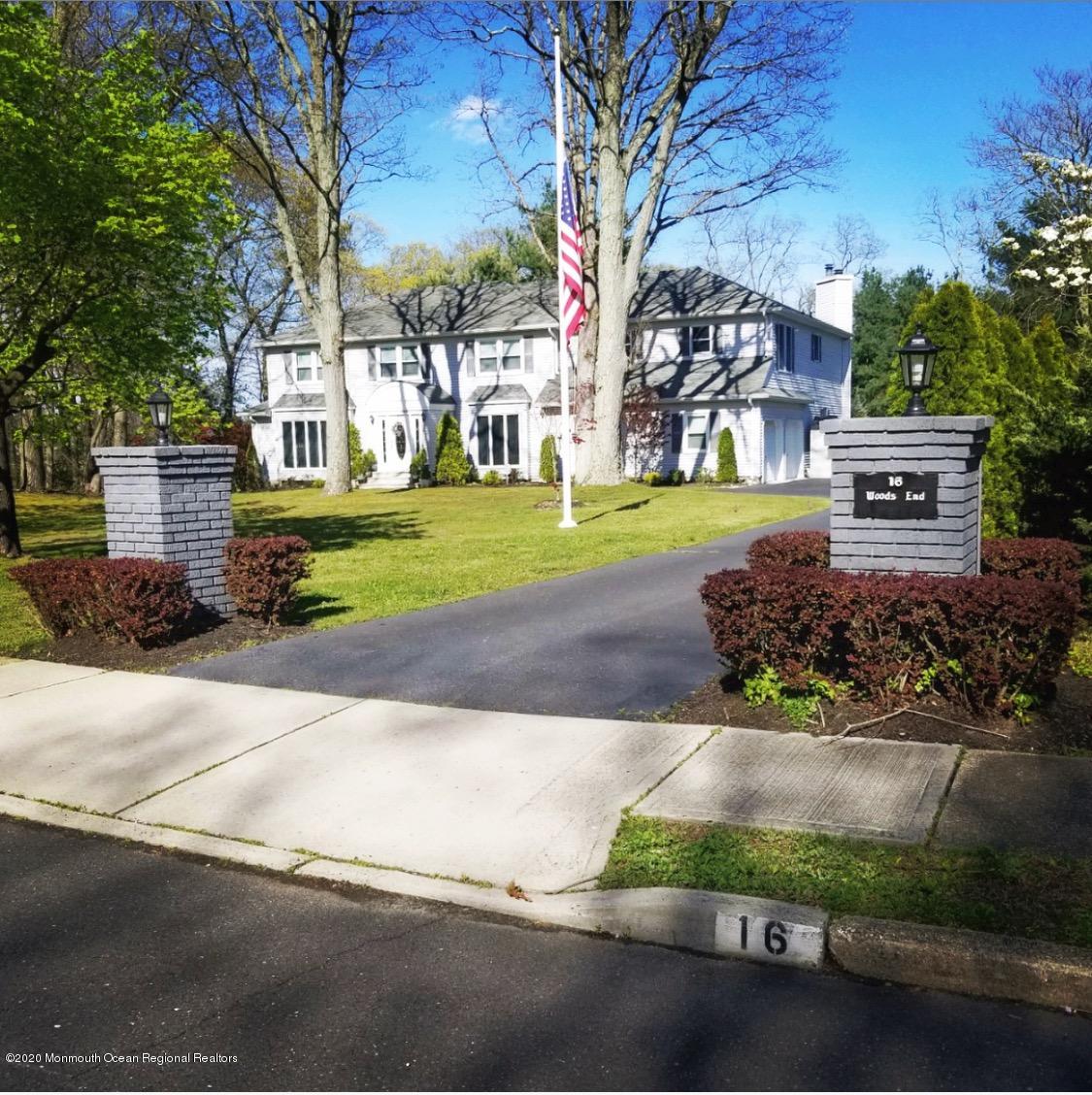 16 Woods Road West Long Branch, NJ 07764 - Photo 38 of 38 a house with trees in front of it