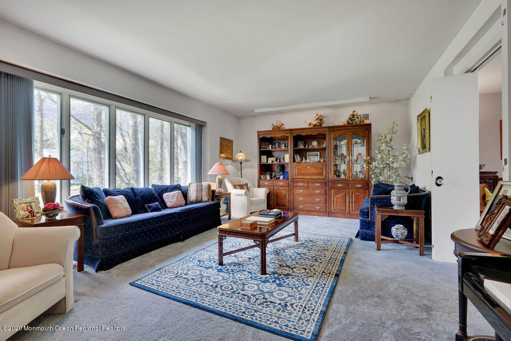 16 Woods Road West Long Branch, NJ 07764 - Photo 5 of 38 a living room with furniture and a rug