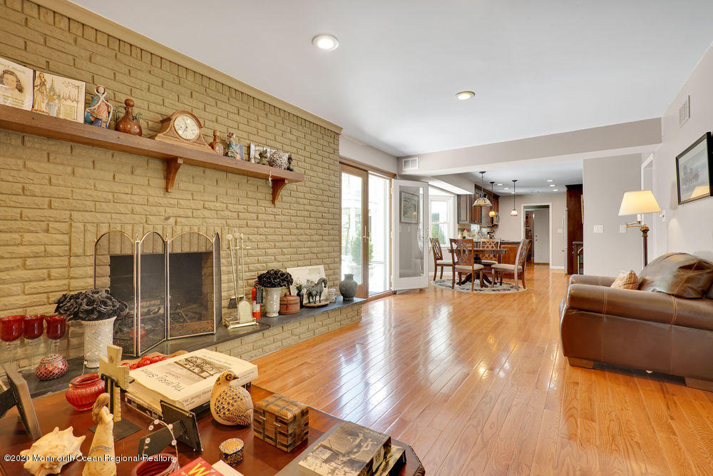 16 Woods Road West Long Branch, NJ 07764 - Photo 7 of 38 a living room with furniture and a fireplace