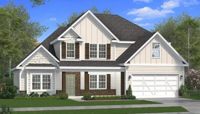 a view of a white house next to a yard