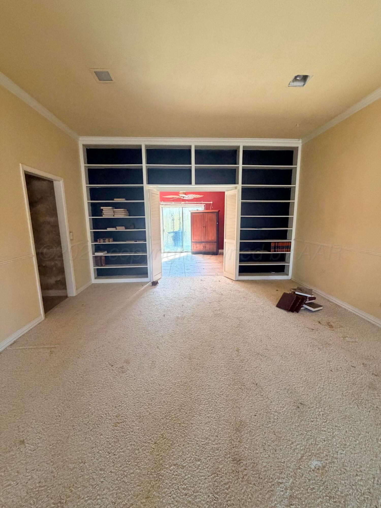 3113 Southwest 28th Avenue Amarillo, TX 79109 - Photo 4 of 10 a view of an empty room with stairs and furniture