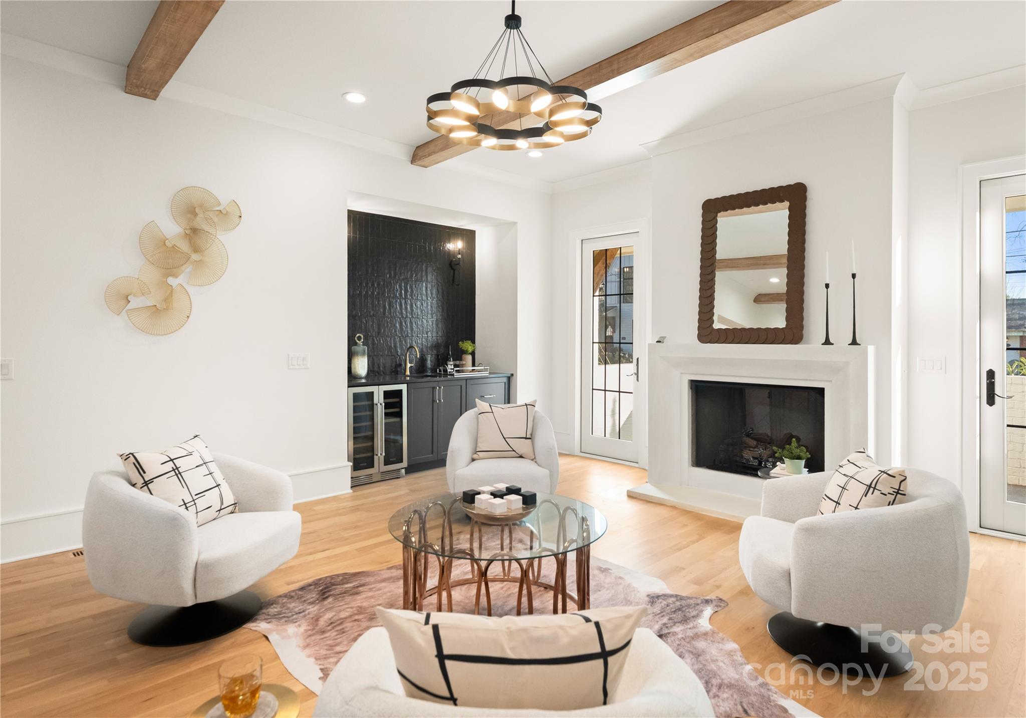 4142 Pineview Road Charlotte, NC 28211 - Photo 14 of 38 a living room with furniture chandelier and a fireplace