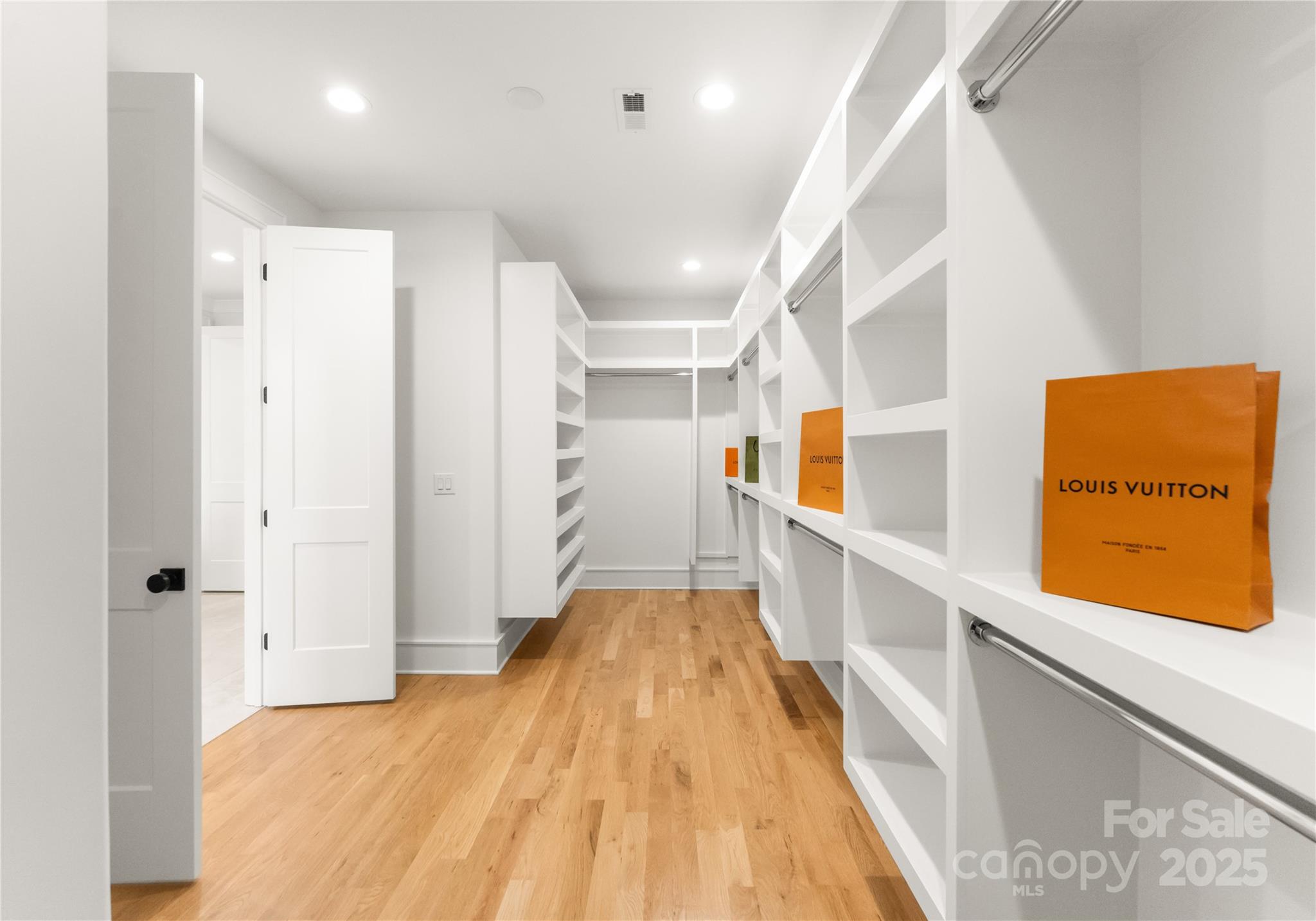 4142 Pineview Road Charlotte, NC 28211 - Photo 19 of 38 a view of a hallway with wooden floor and staircase