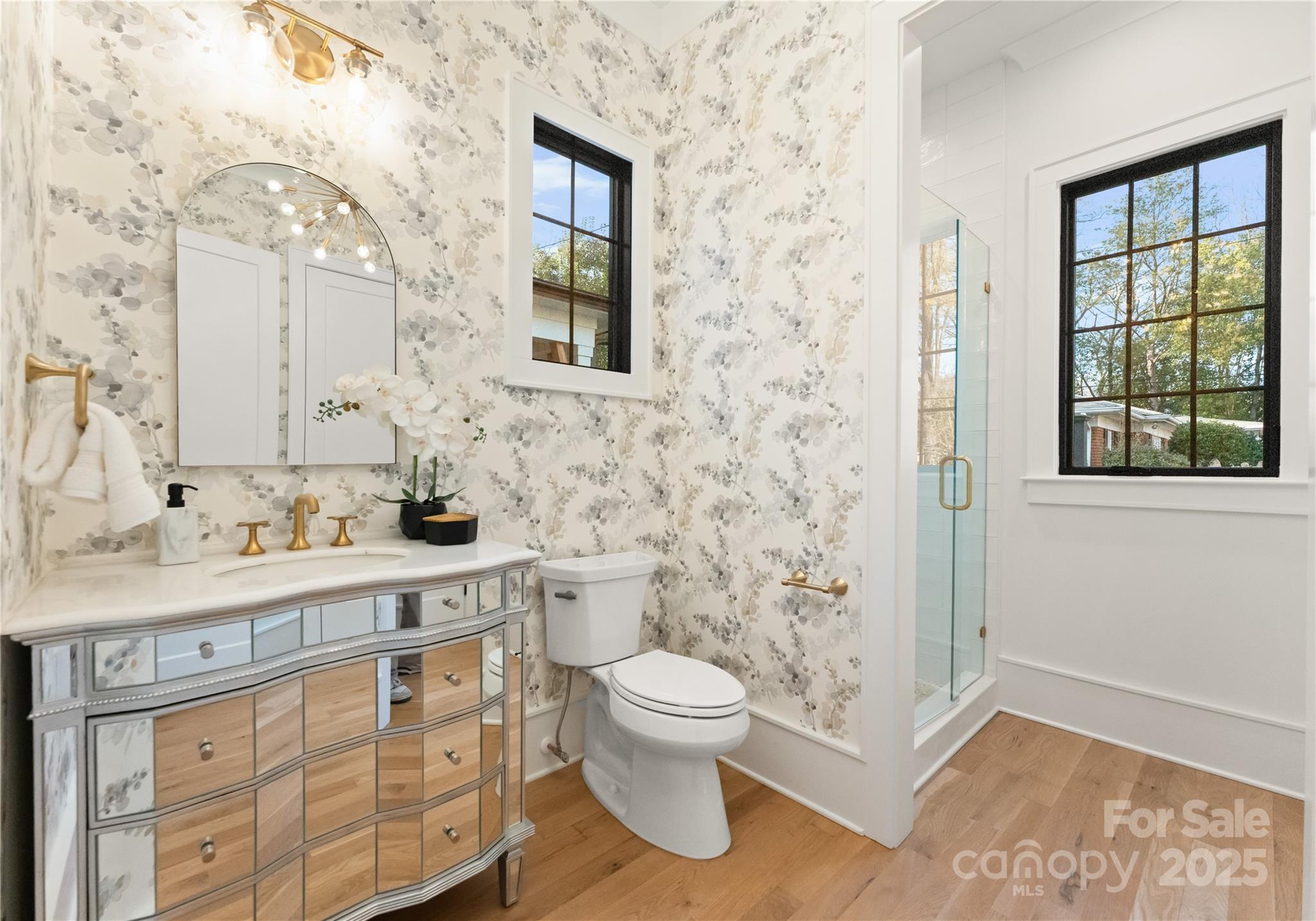 4142 Pineview Road Charlotte, NC 28211 - Photo 21 of 38 a bathroom with a sink a toilet and a window
