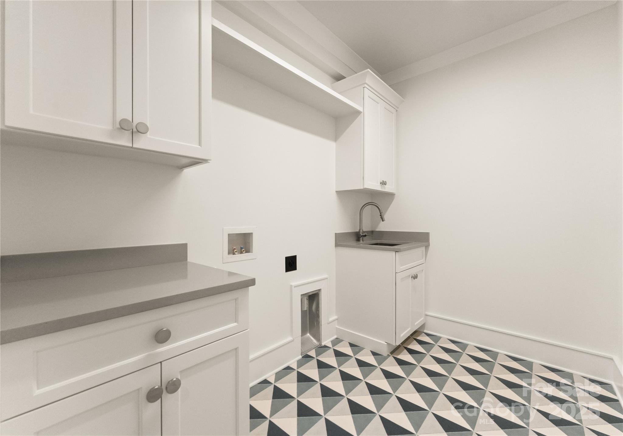 4142 Pineview Road Charlotte, NC 28211 - Photo 22 of 38 a room with a washing machine and cabinets