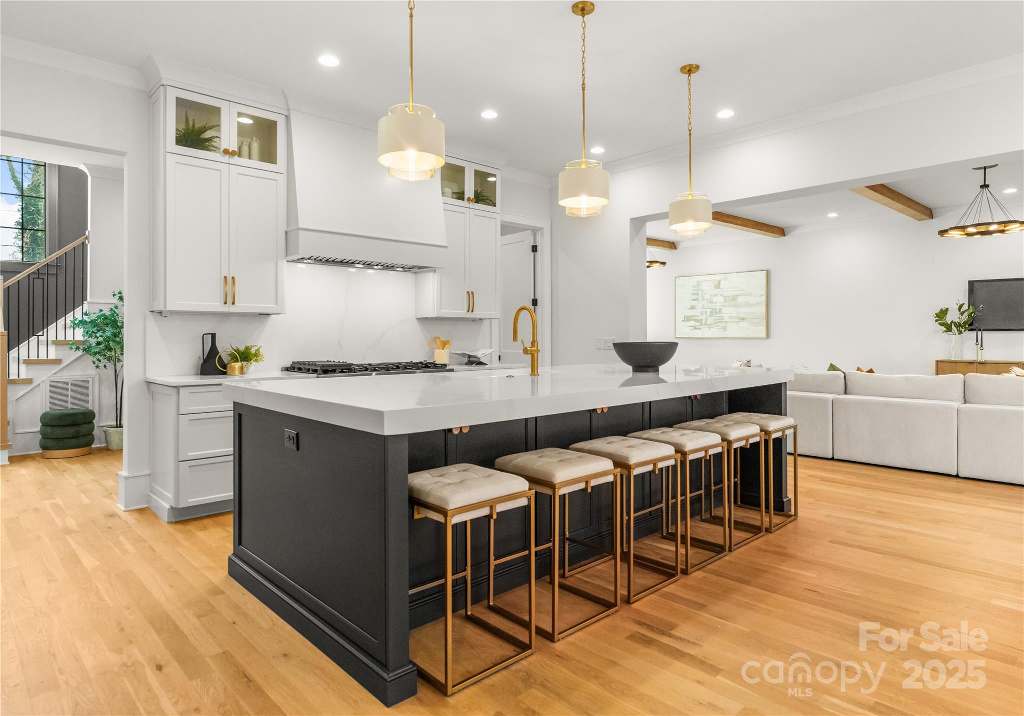 4142 Pineview Road Charlotte, NC 28211 - Photo 5 of 38 a large kitchen with kitchen island a large counter space a sink stainless steel appliances and cabinets