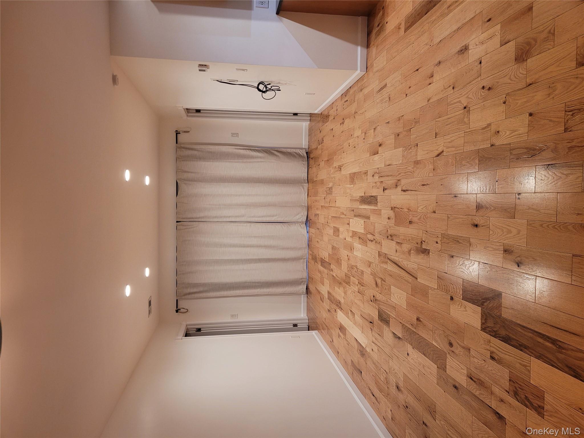 31 Apricot Road Rocky Point, NY 11778 - Photo 25 of 31 Empty room with light wood finished floors and recessed lighting