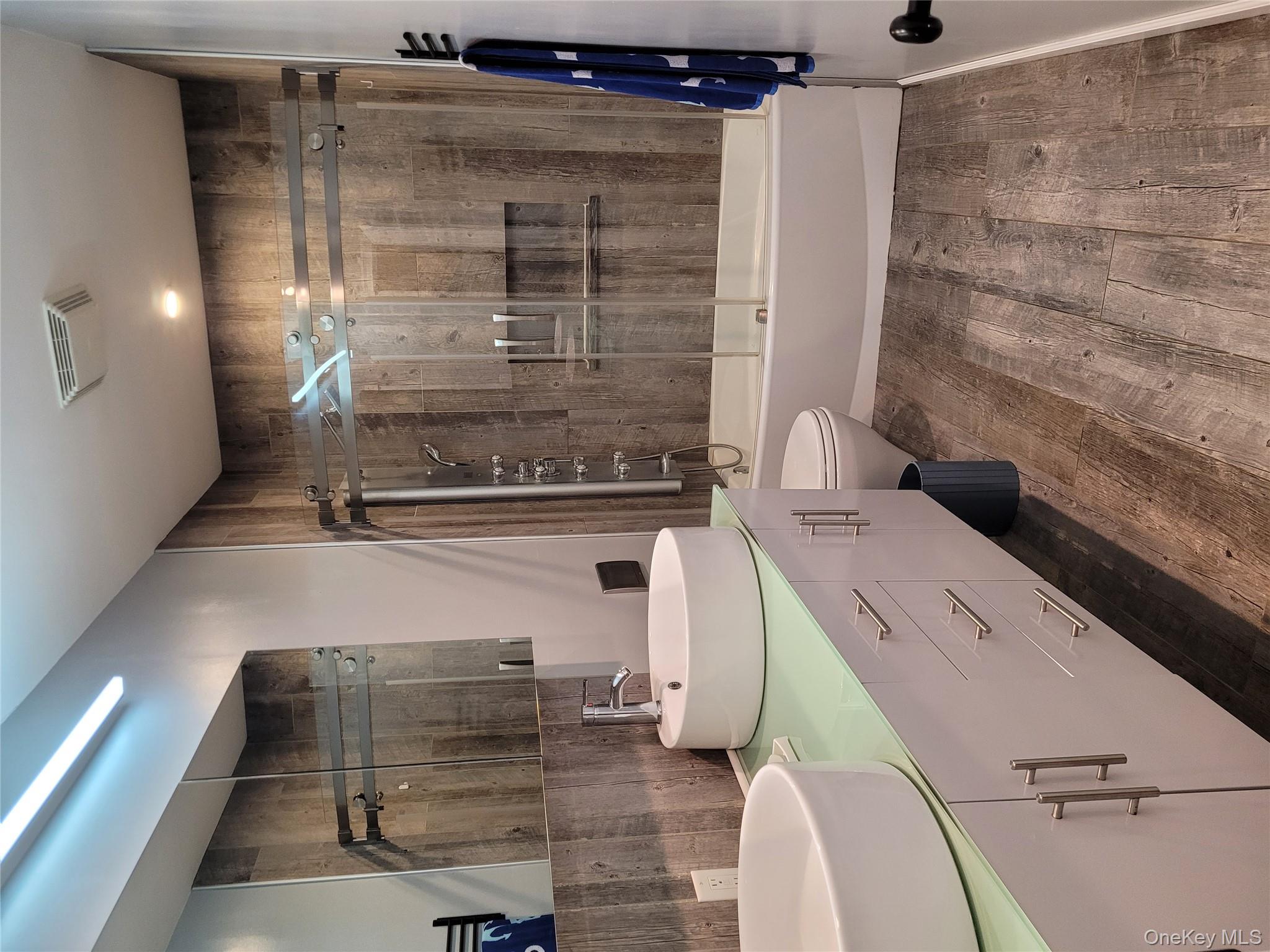 31 Apricot Road Rocky Point, NY 11778 - Photo 6 of 31 Full bath featuring wood finished floors, shower / bath combination with glass door, and double vanity