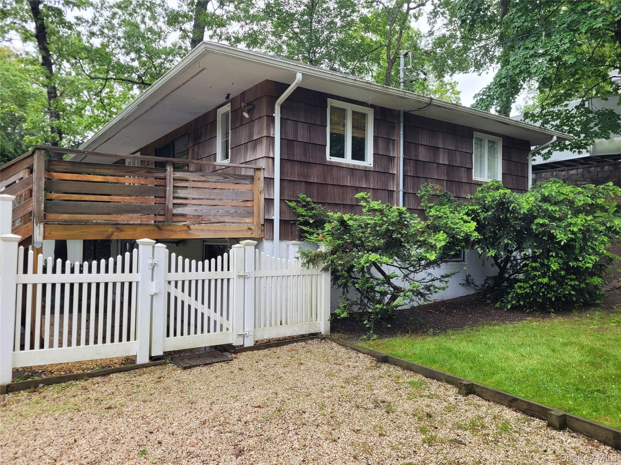 31 Apricot Road Rocky Point, NY 11778 - Photo 10 of 31 View of front of property featuring a gate