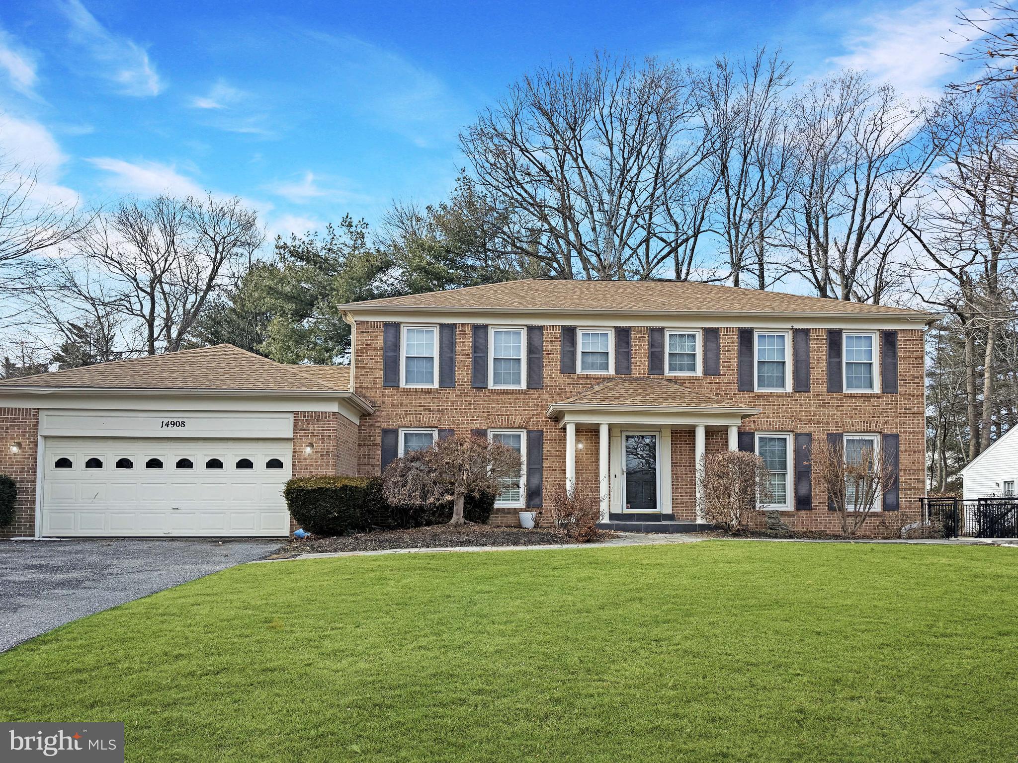 14908 Village Gate Drive Silver Spring, MD 20906 - Photo 1 of 57 a front view of a house with a garden