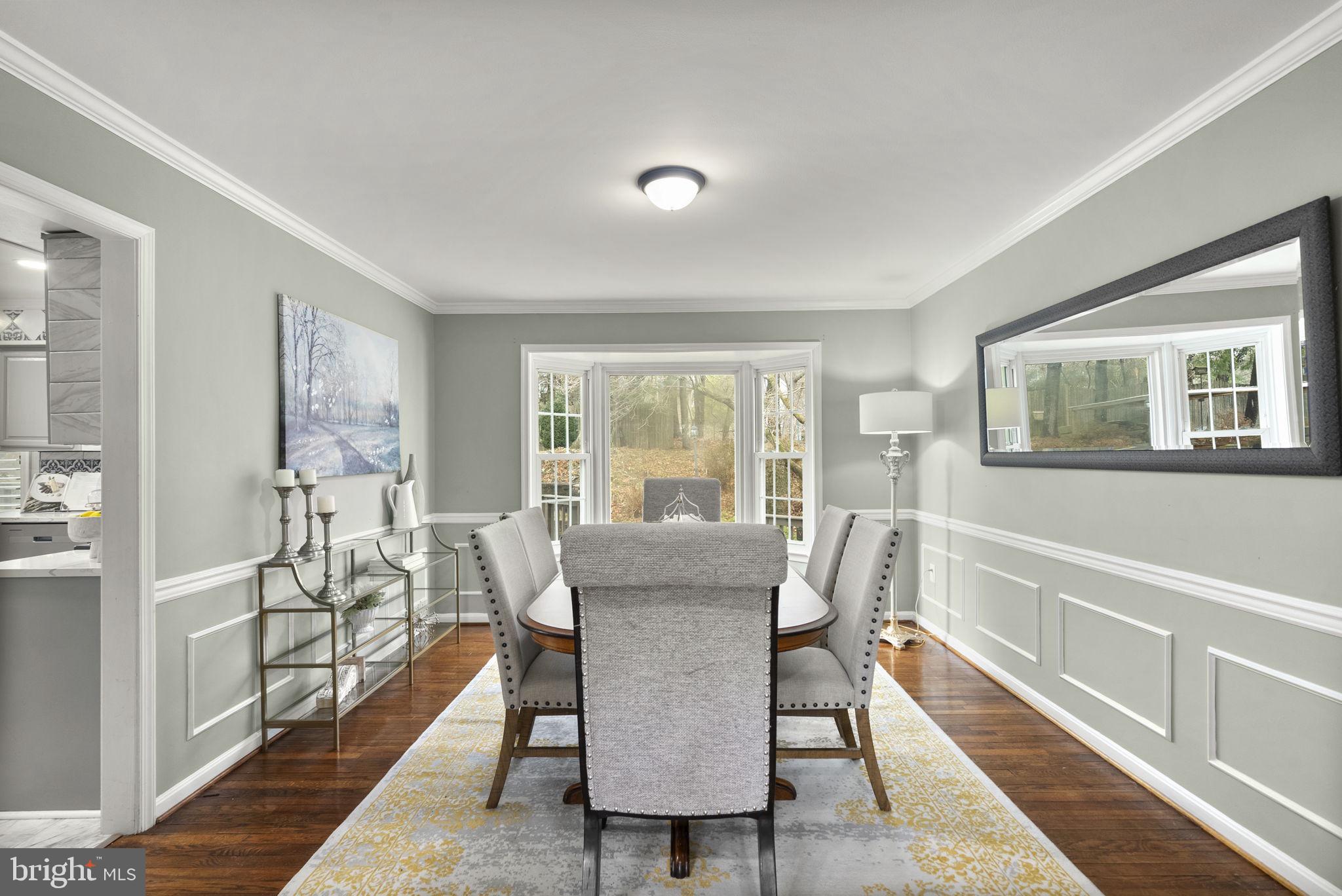 14908 Village Gate Drive Silver Spring, MD 20906 - Photo 13 of 57 a view of a dining room with furniture window and wooden floor