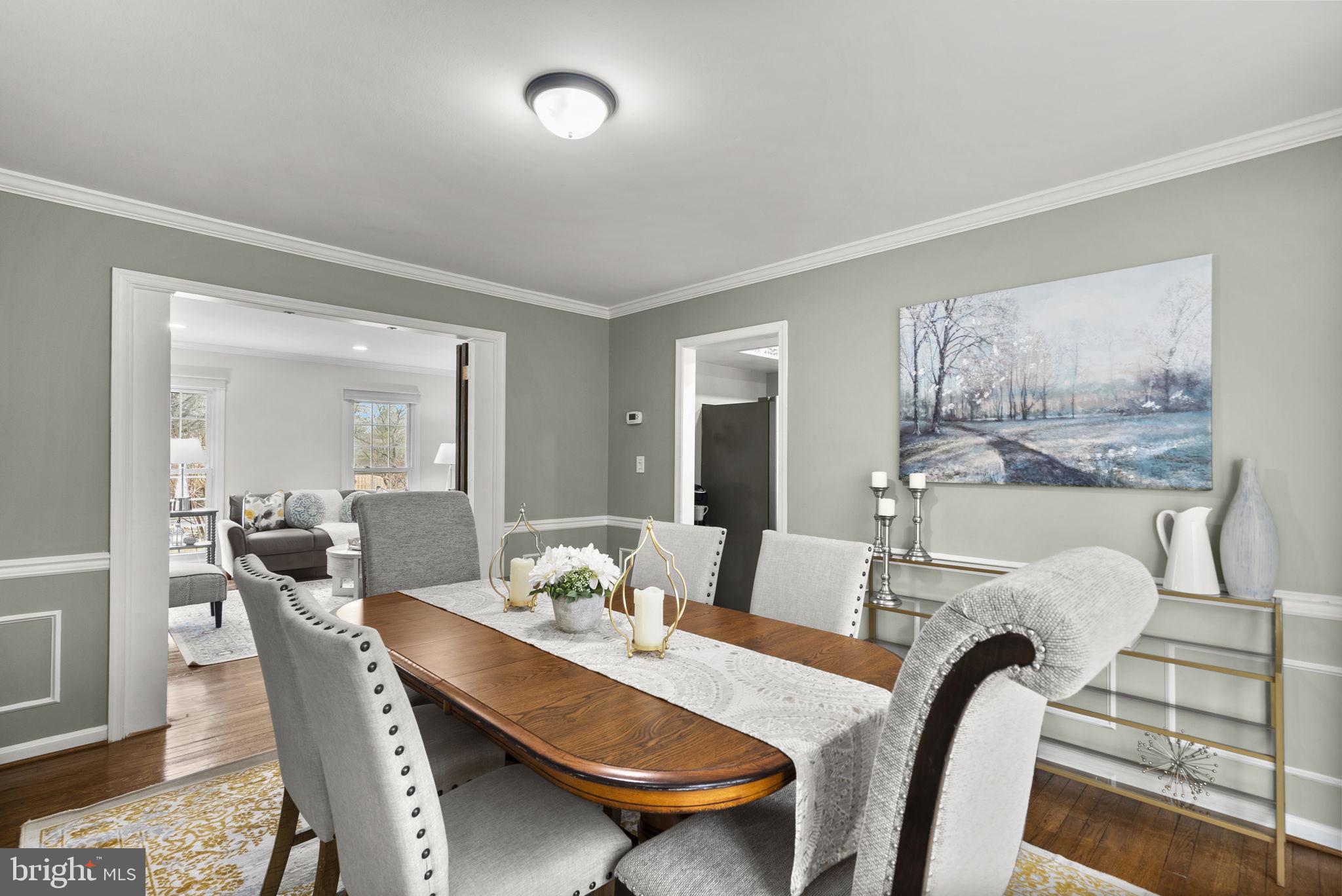 14908 Village Gate Drive Silver Spring, MD 20906 - Photo 14 of 57 a dining room with furniture and wooden floor