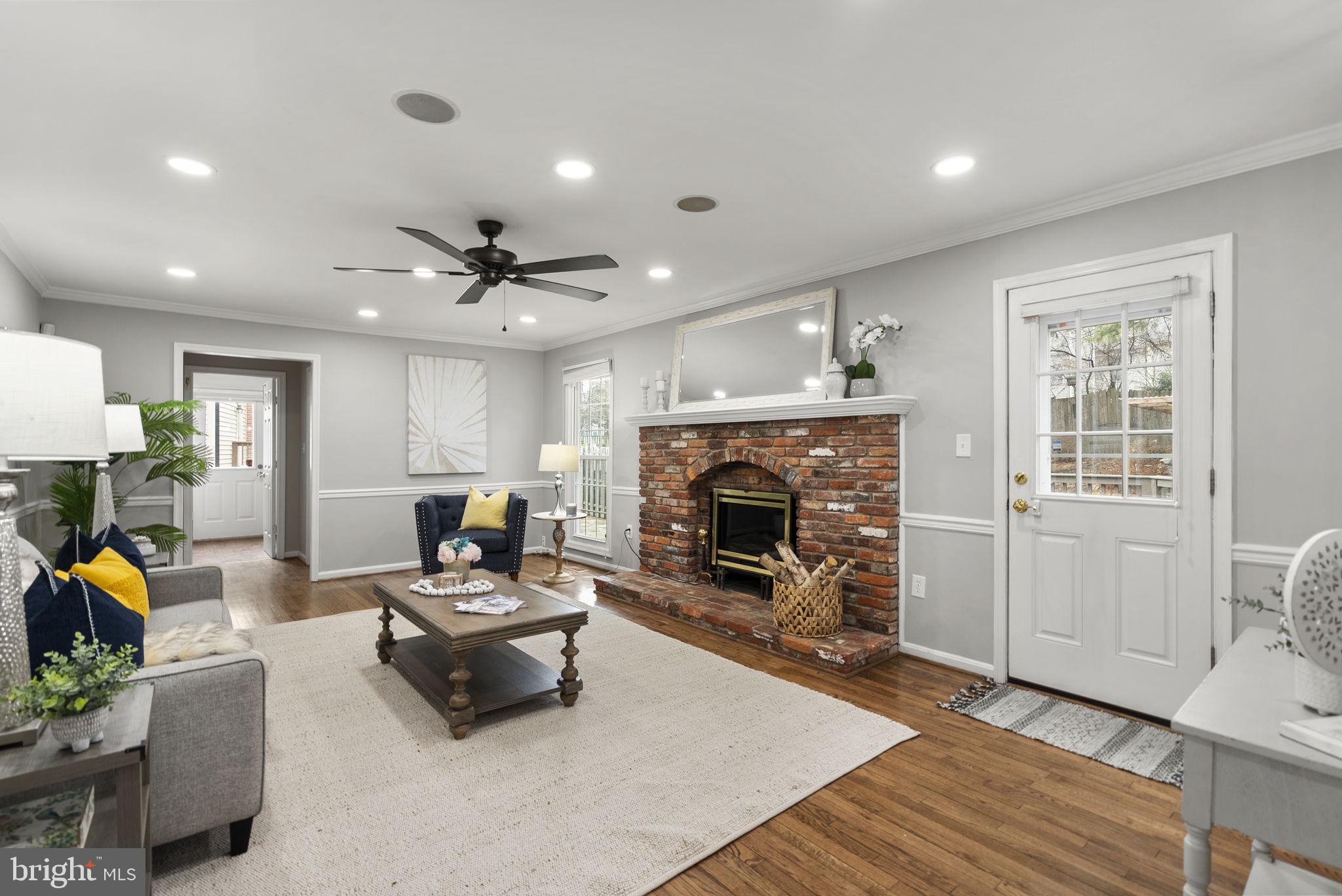 14908 Village Gate Drive Silver Spring, MD 20906 - Photo 15 of 57 a living room with furniture and a fireplace