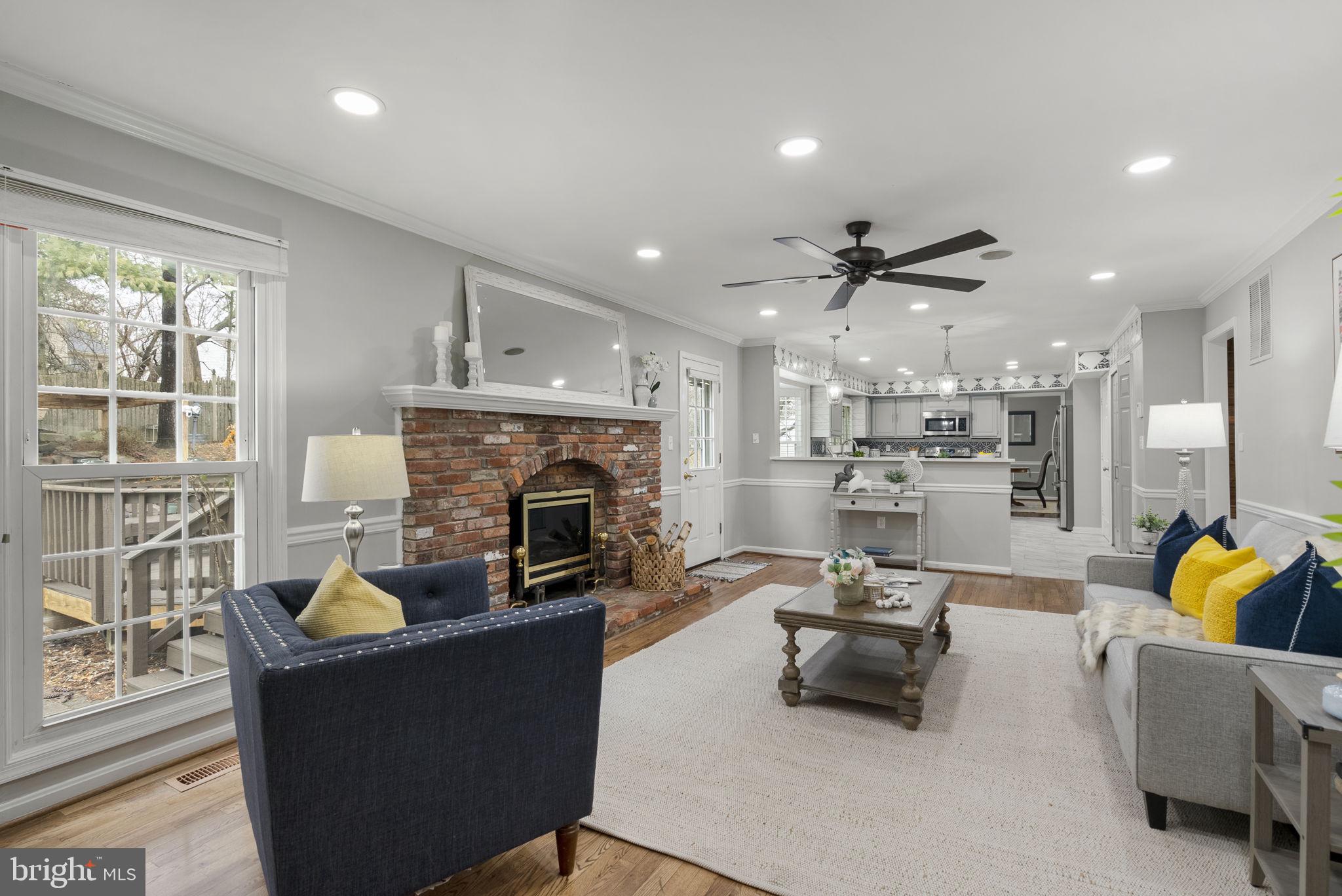 14908 Village Gate Drive Silver Spring, MD 20906 - Photo 16 of 57 a living room with furniture and a fireplace