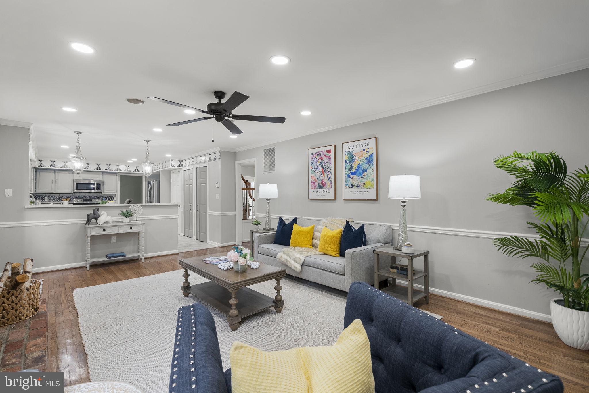 14908 Village Gate Drive Silver Spring, MD 20906 - Photo 17 of 57 a living room with furniture kitchen view and a potted plant