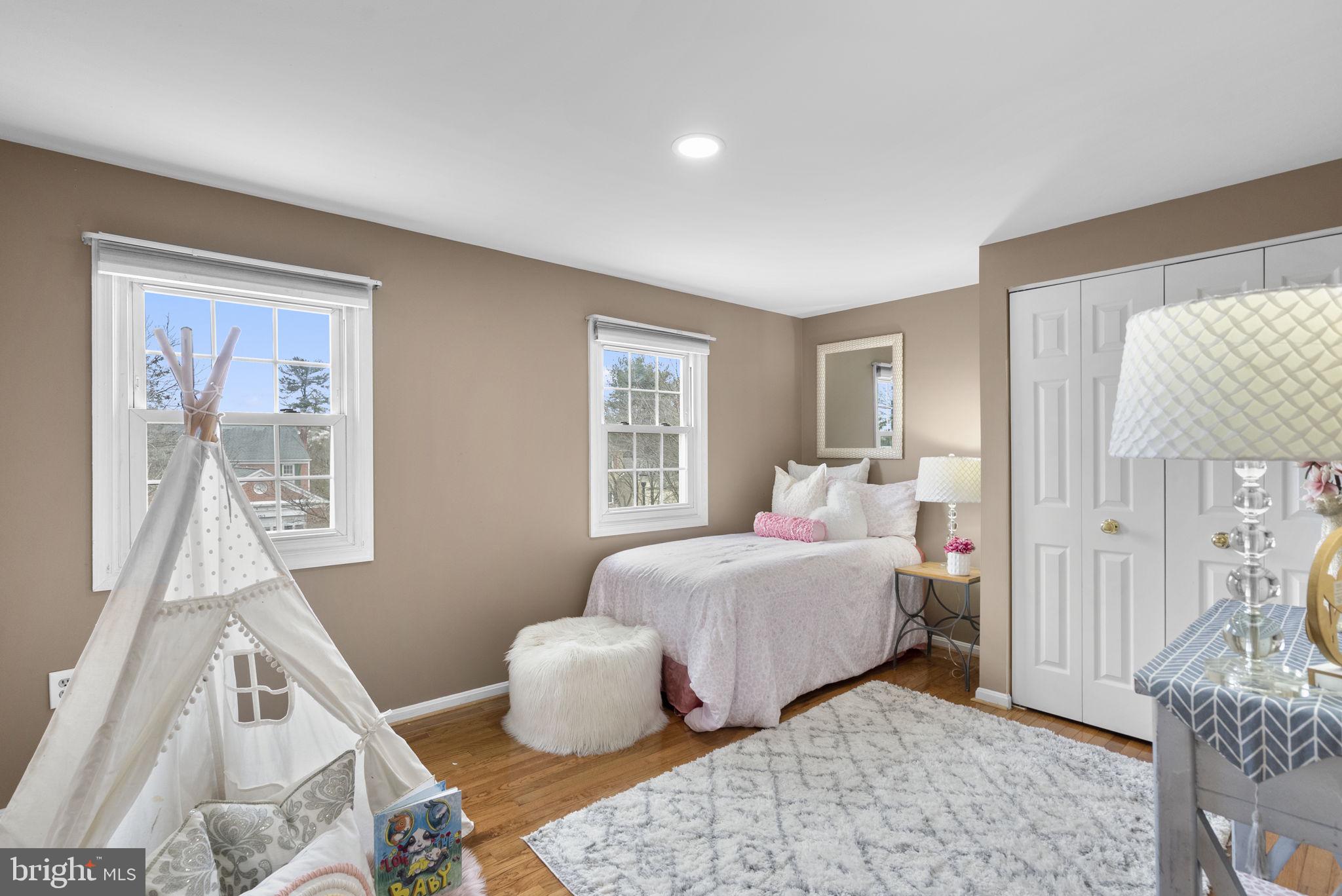 14908 Village Gate Drive Silver Spring, MD 20906 - Photo 24 of 57 a bedroom with a bed and wooden floor