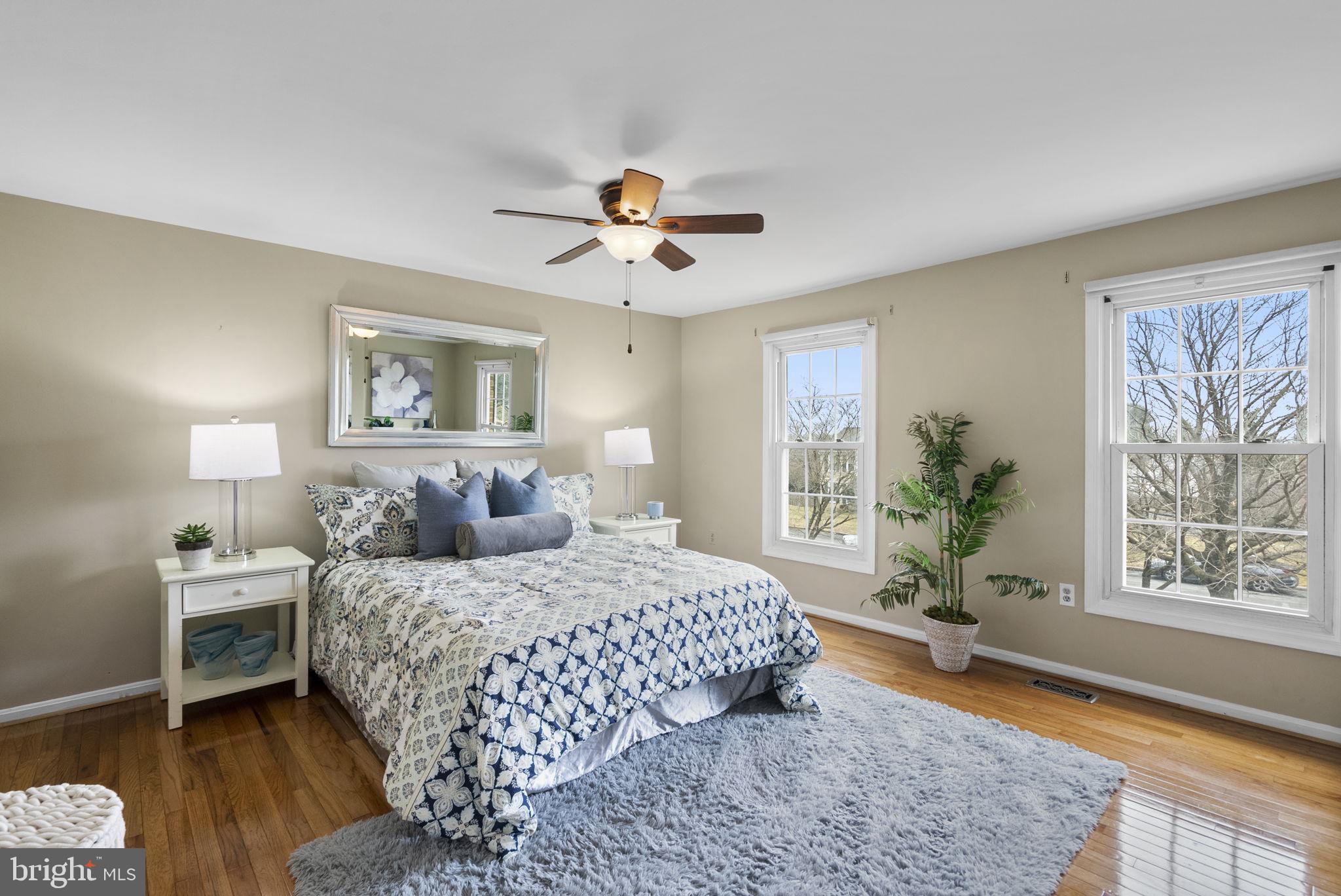 14908 Village Gate Drive Silver Spring, MD 20906 - Photo 25 of 57 a bedroom with a large bed and a window