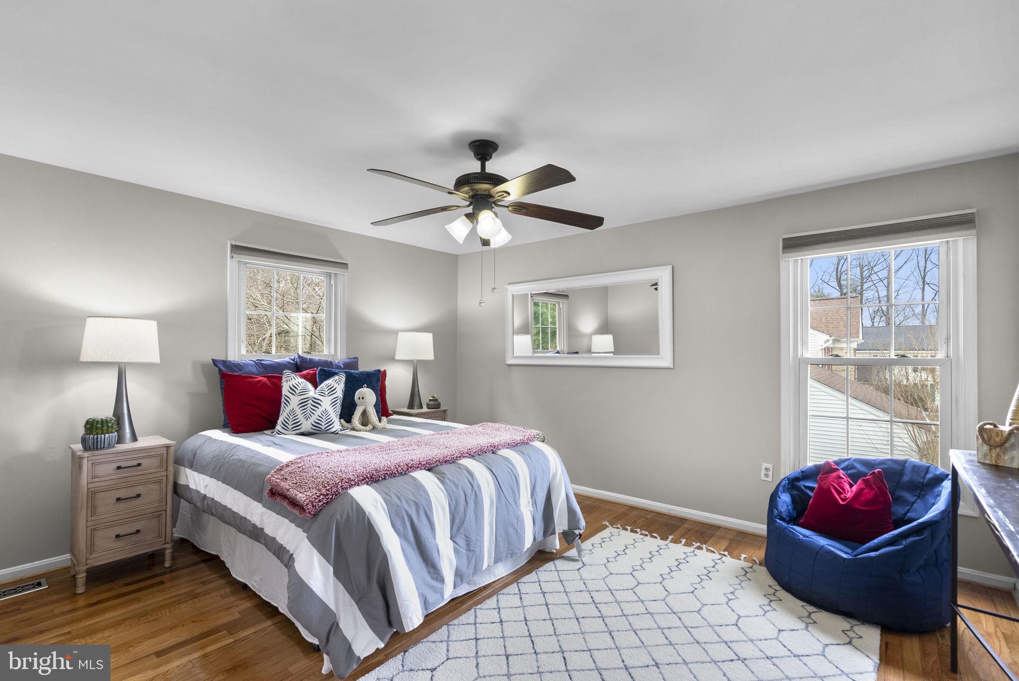 14908 Village Gate Drive Silver Spring, MD 20906 - Photo 26 of 57 a bedroom with a bed and a chandelier