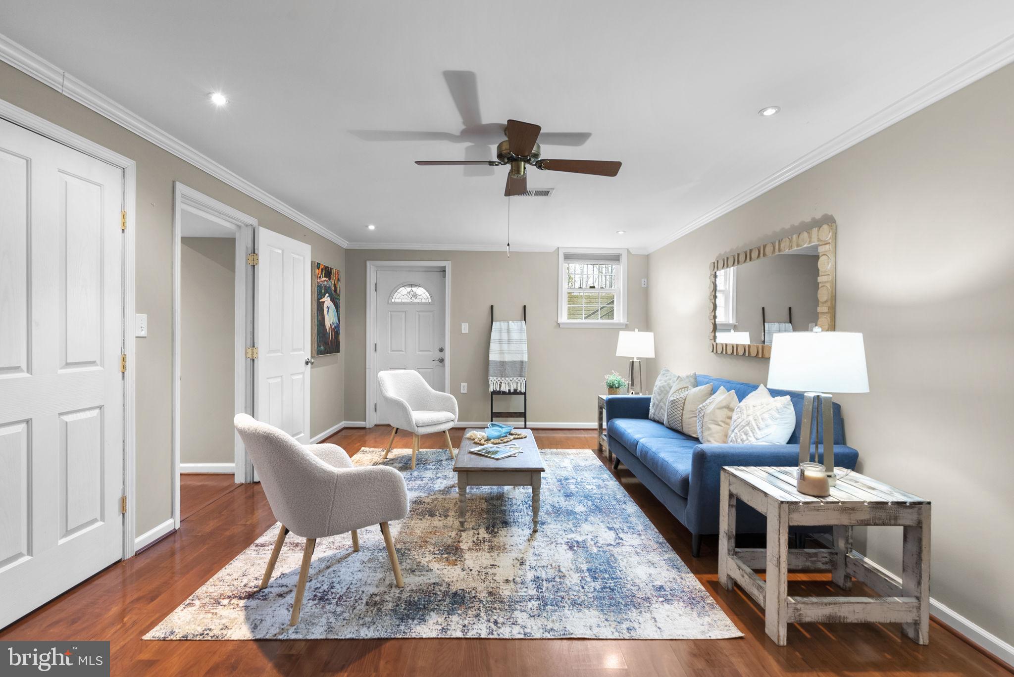 14908 Village Gate Drive Silver Spring, MD 20906 - Photo 29 of 57 a living room with furniture and a wooden floor