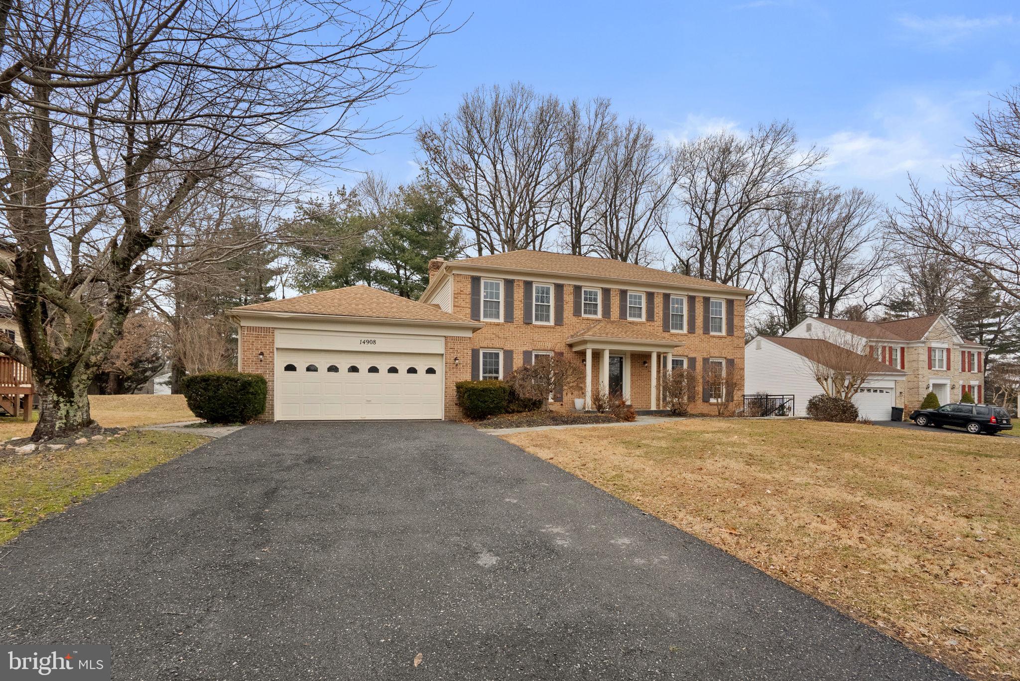 14908 Village Gate Drive Silver Spring, MD 20906 - Photo 3 of 57 a view of house with yard and trees in the background