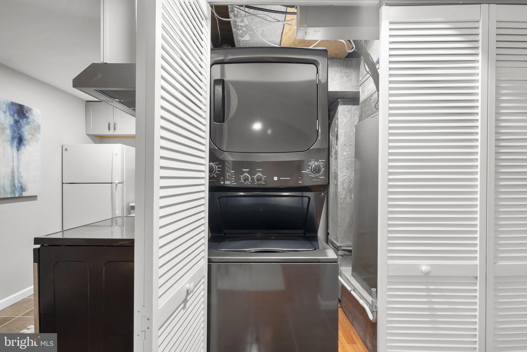 14908 Village Gate Drive Silver Spring, MD 20906 - Photo 32 of 57 a kitchen with a refrigerator and a stove