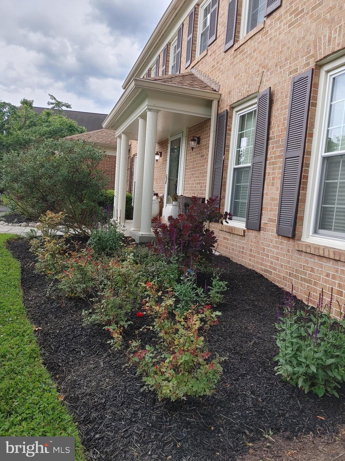 14908 Village Gate Drive Silver Spring, MD 20906 - Photo 45 of 57 a front view of a house with garden