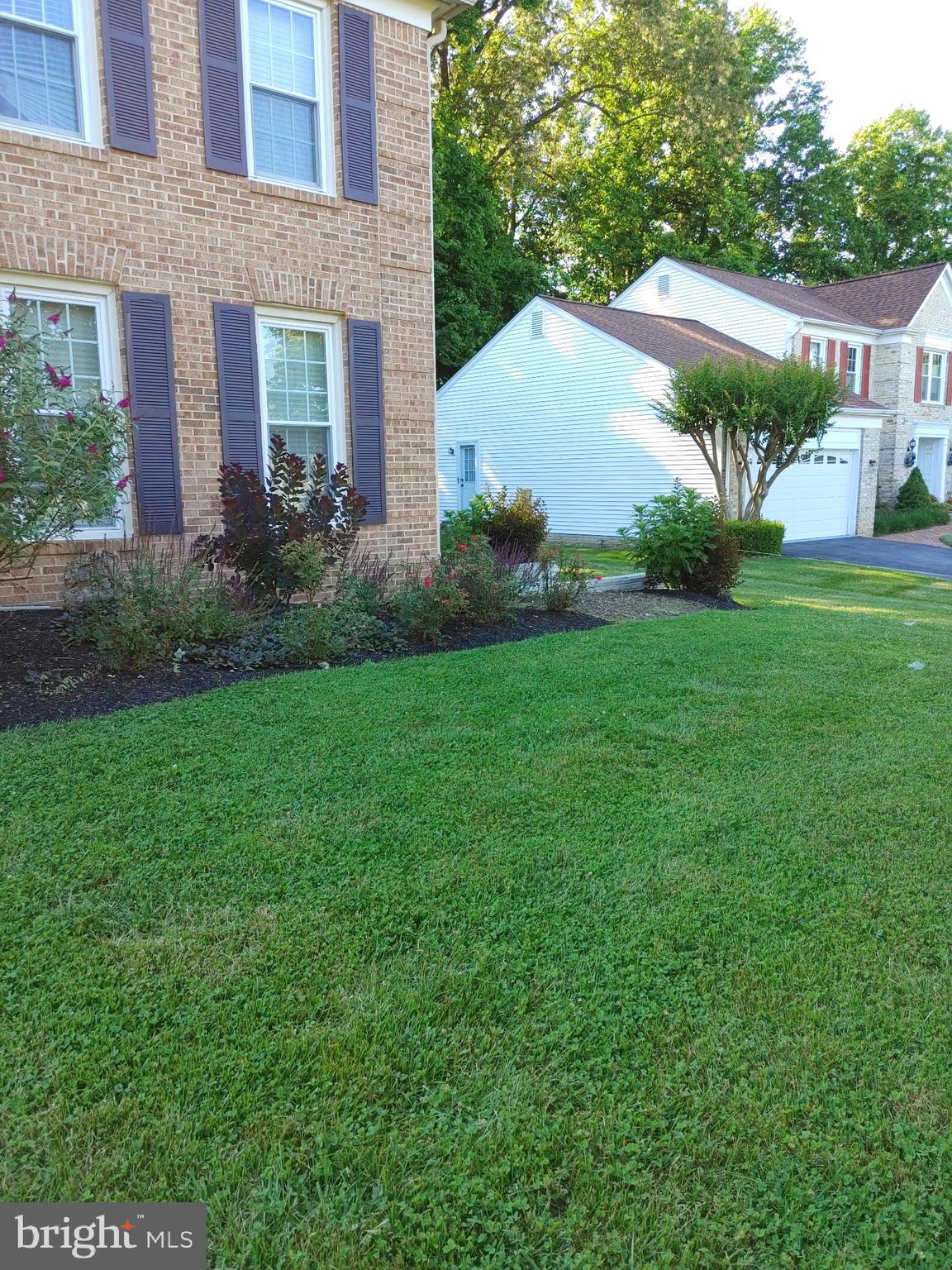 14908 Village Gate Drive Silver Spring, MD 20906 - Photo 47 of 57 a view of a house with a yard and plants