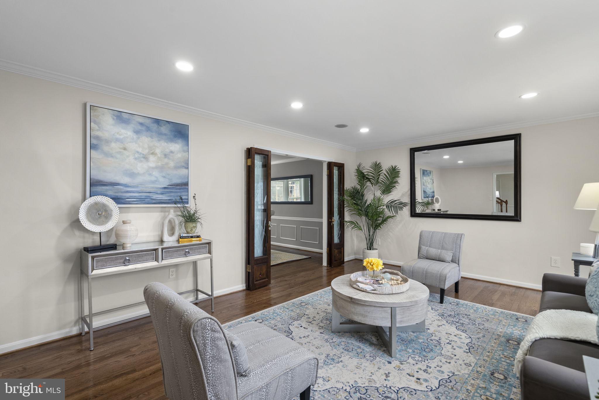 14908 Village Gate Drive Silver Spring, MD 20906 - Photo 10 of 57 a living room with furniture and a table