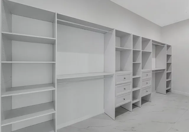 a bathroom with a toilet a sink a mirror and a bathtub