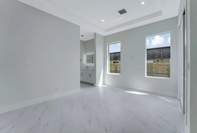 an aerial view of a house with garden space and street view