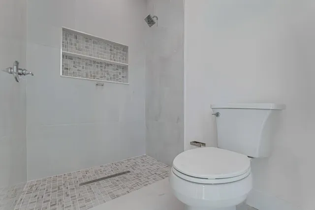 an aerial view of a house with a garden and trees